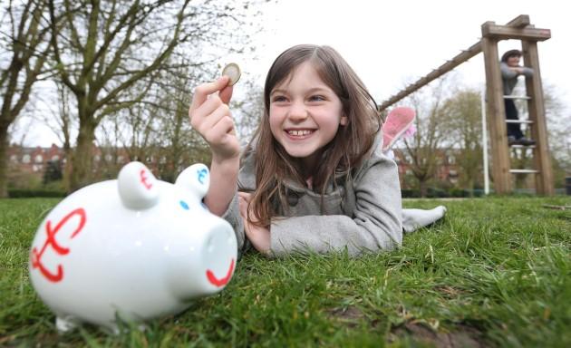 Aisling Kavanagh aged 8 poses with a piggy bank to highlight Scottish Widows' new research which reveals that more than one in ten children has already started their lifelong savings.
Issue date: Thursday May 2, 2013. 70\% of children, some as young as 1