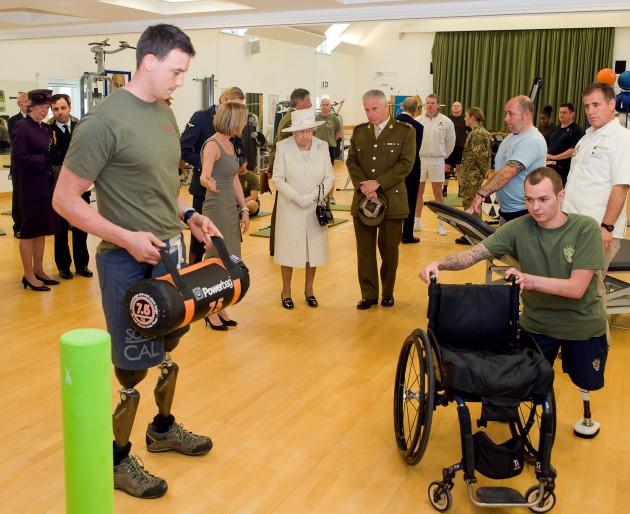 Queen Elizabeth II visiting patients and staff at the Defence Medical Rehabilitation Centre at Headley Court in Surrey.
Picture date: Thursday May 2, 2013.