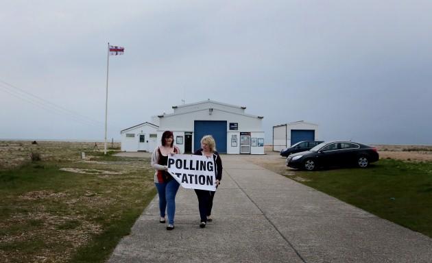 Poll Clerk Amelia Hetterley (left) and Presiding Officer Sue Bunney, set up their polling station at Dungeness Lifeboat Station in Dungeness, Kent, as voters go to the polls in local elections.
Picture date: Thursday May 2, 2013