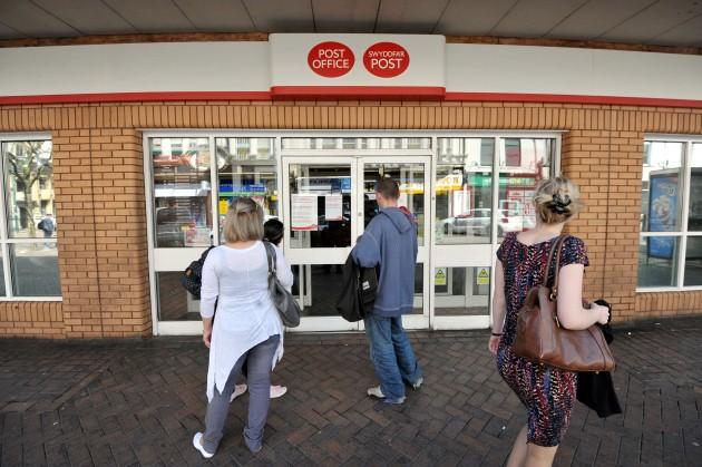 Customers encounter locked doors at the Post Office branch in Bridge Street, Newport after workers in the country's biggest post offices staged a fresh strike over jobs, pay and branch closures today, saying members of the public were supporting their cam