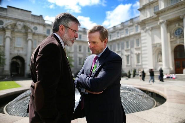 Sinn Fein President Gerry Adams (left) appears deep in conversation as he meets Taoiseach Enda Kenny in front of Government Buildings today.
Picture date: Wednesday May 8, 2013.