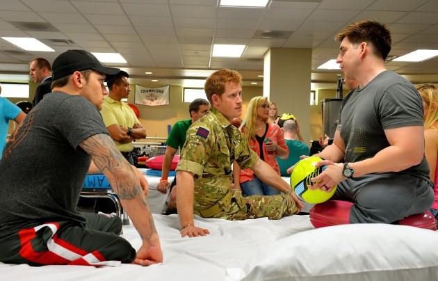 Prince Harry talks to staff Sergeant Timothy Payne (right) during a visit to the Walter Reed National Military Medical Centre in Washington, on the second day of his seven-day visit to the United States.
Picture date: Friday May 10, 2013.