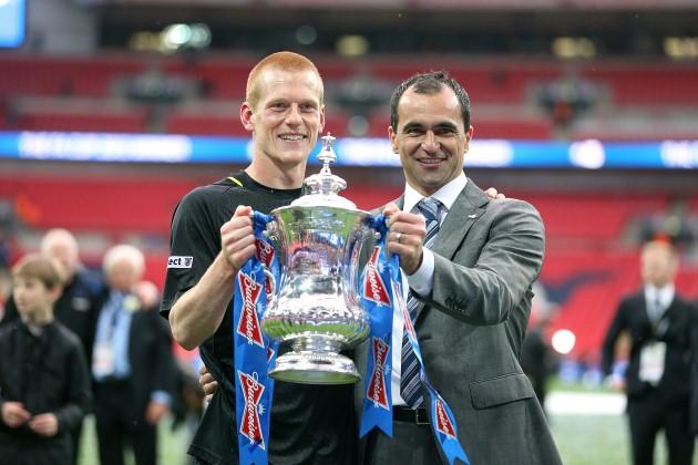 Wigan Athletic manager Roberto Martinez and winning goalscorer Ben Watson (left) pose with the trophy following their victory over Manchester City in the FA Cup final.