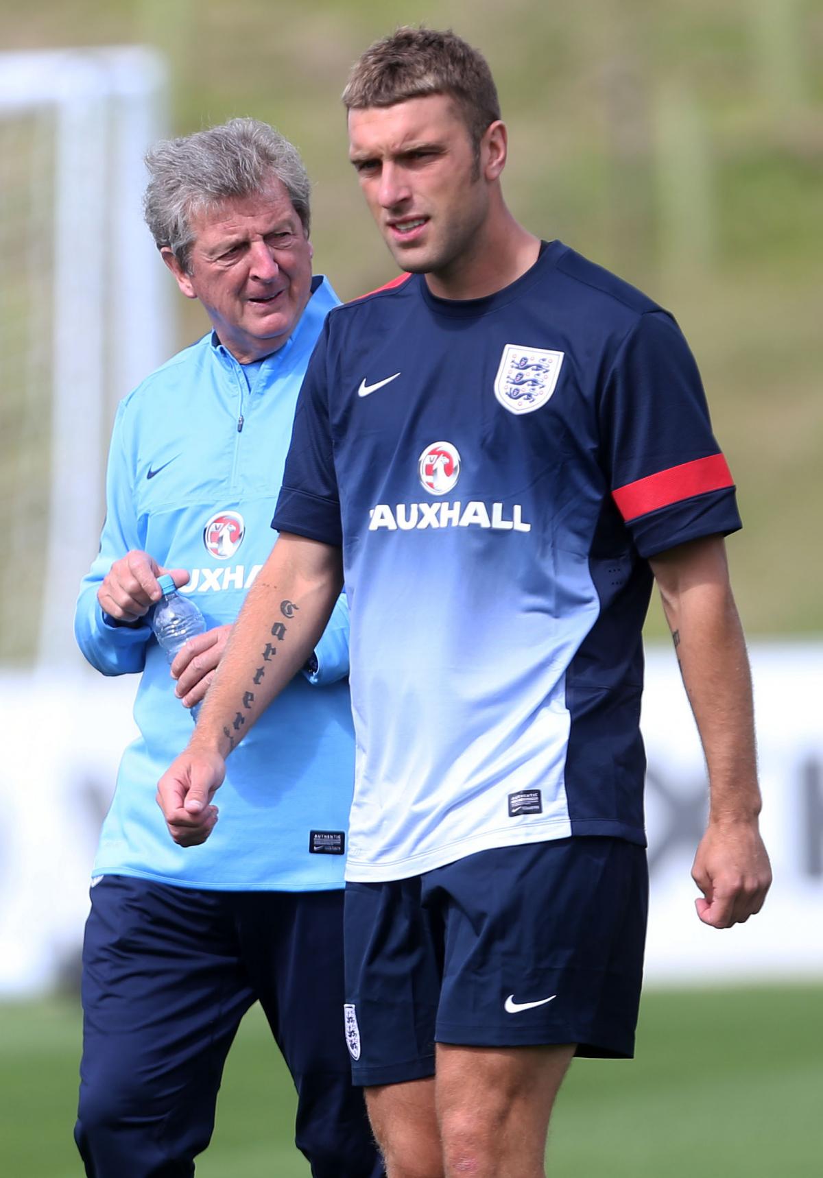 Roy Hodgson keeps an eye on Rickie Lambert in England training