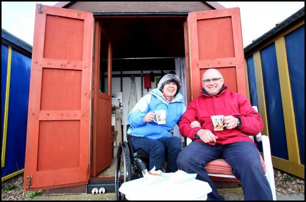 Christine and Jack Wyatt from Romsey enjoy a cup of tea in bracing winds at Calshot.

They went down to see if there was any damage to their hut, but were 'thrilled' to discover everything was perfectly fine. Pictures from the aftermath of the winds whi