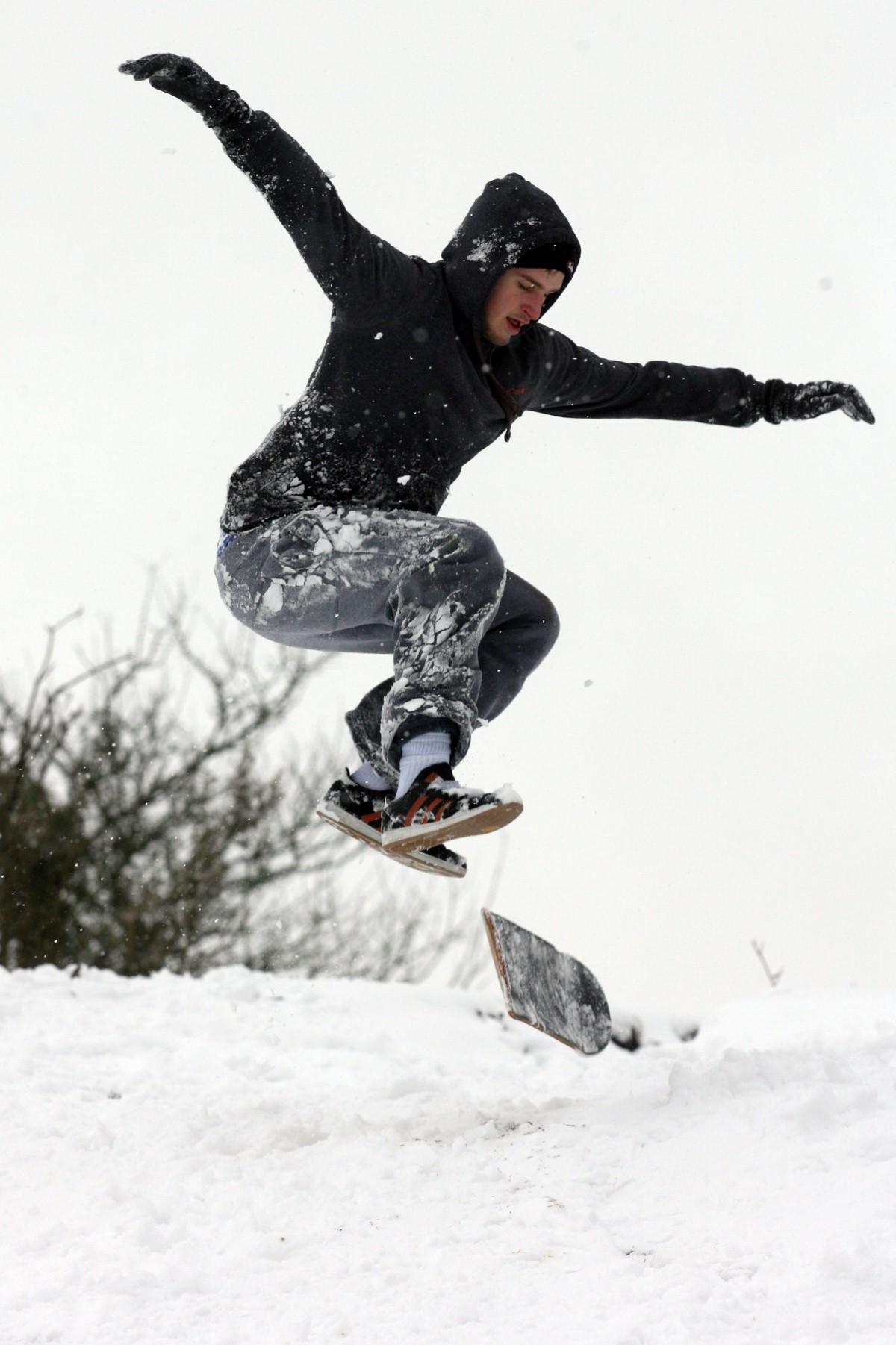 The Year in Pictures - 2013 - When snow hit the New Forest, Nick Richardson used an adapted skateboard at Botons Bench in Lyndhurst. January 18, 2013.