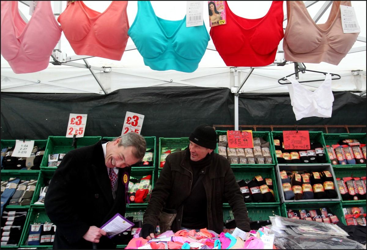 The Year in Pictures - 2013 - UKIP leader Nigel Farage spoke with stall holder Gary Williams in Eastleigh in the week that he allegedly made disparaging remarks about the role of women in his party. February 9, 2013.