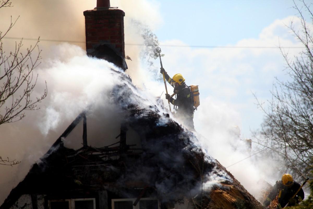 The Year in Pictures - 2013 - Firefighters tackle a blaze at a thatched cottage in Durley. April 19, 2013.