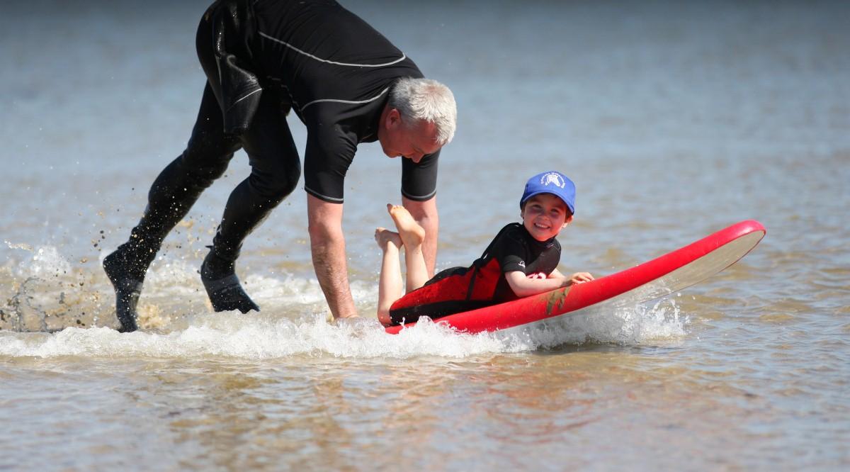 The Year in Pictures - 2013 - Chris Cleland playing with his son Leo at Calshot Beach. May 6, 2013.