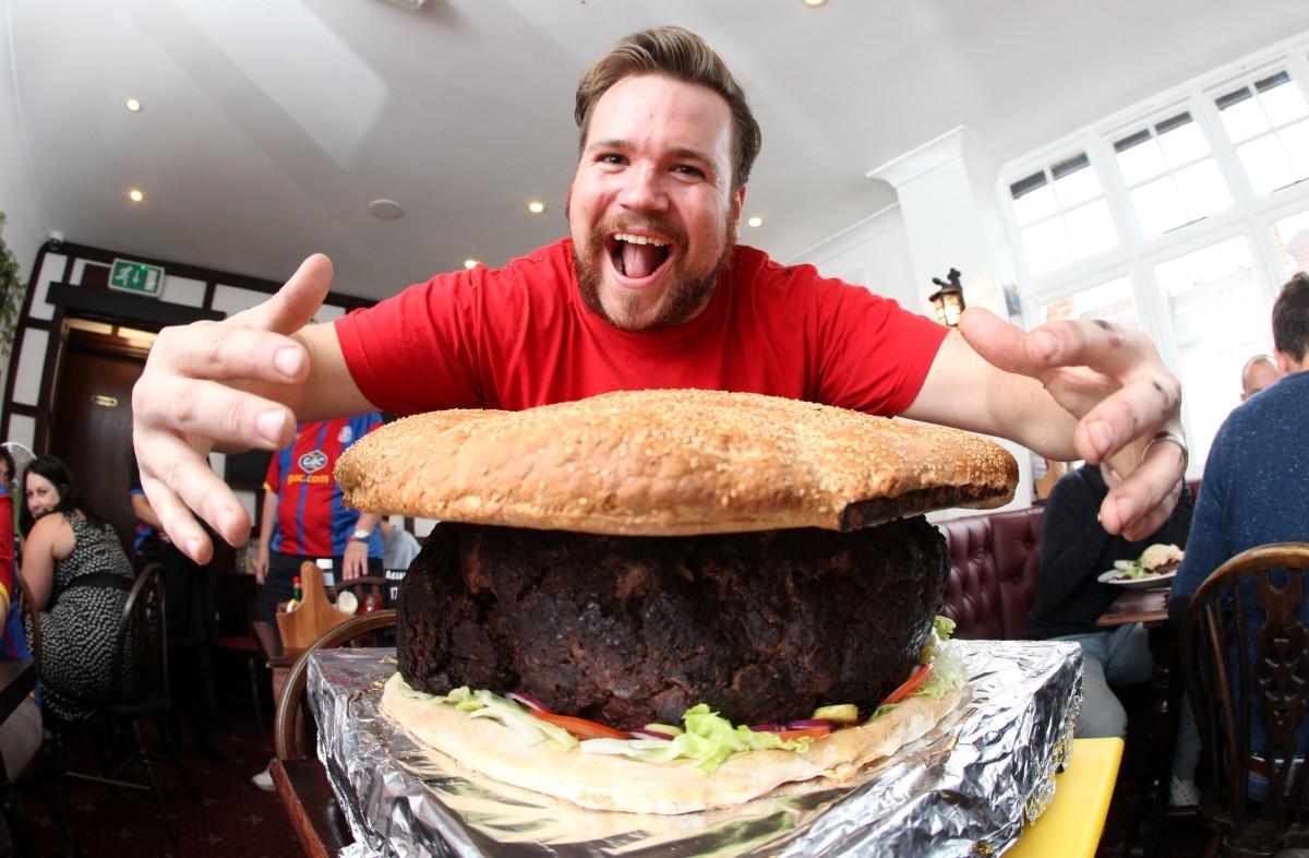 The Year in Pictures - 2013 - Max Greenwood, the landlord of the Rockstone Pub was pictured with their giant burger which they believe is the largest in the world. October 2, 2013.