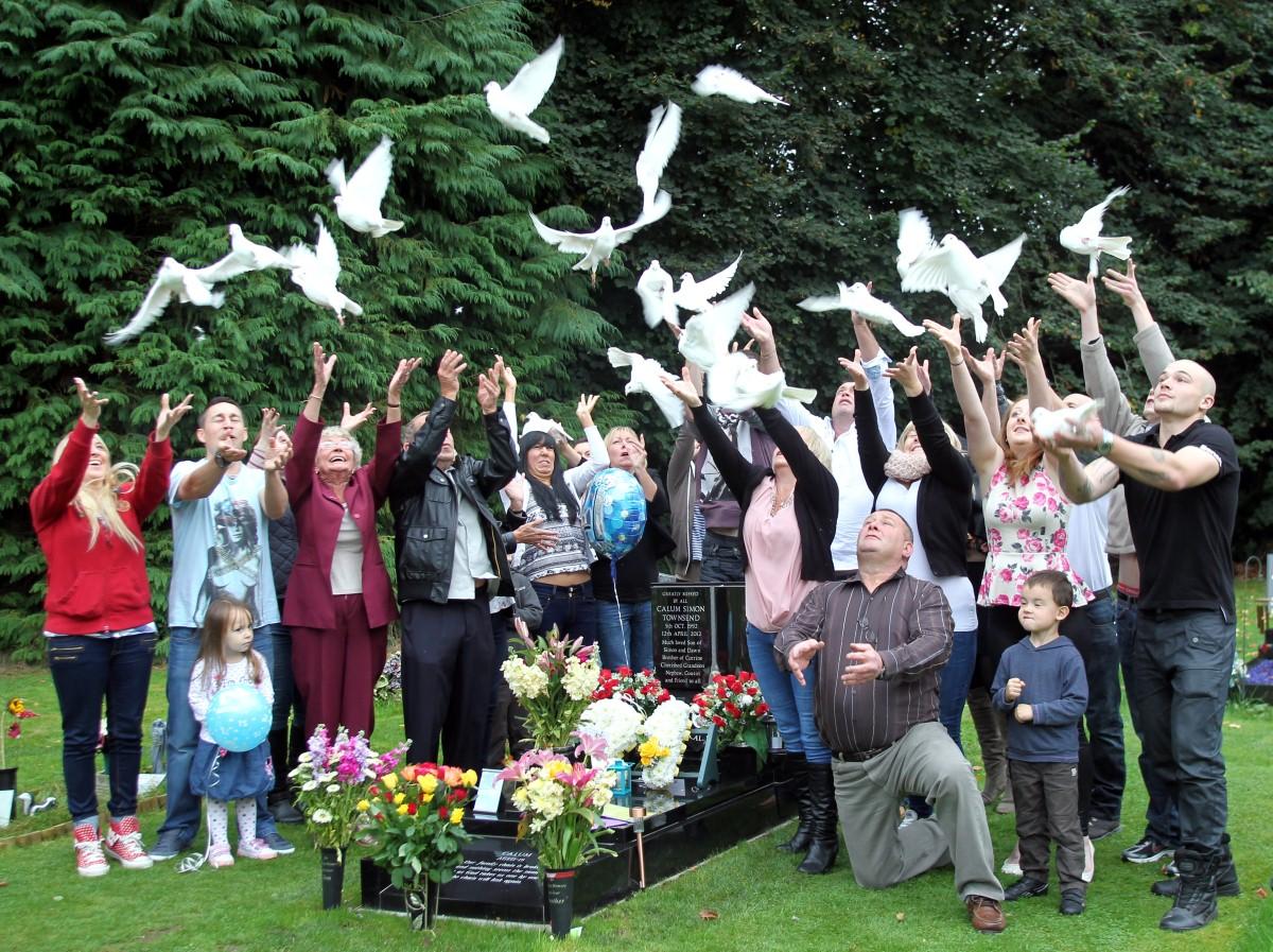 The Year in Pictures - 2013 - The family and friends of Calum Townsend released doves at his graveside on what would have been his 21st birthday. October 5, 2013.