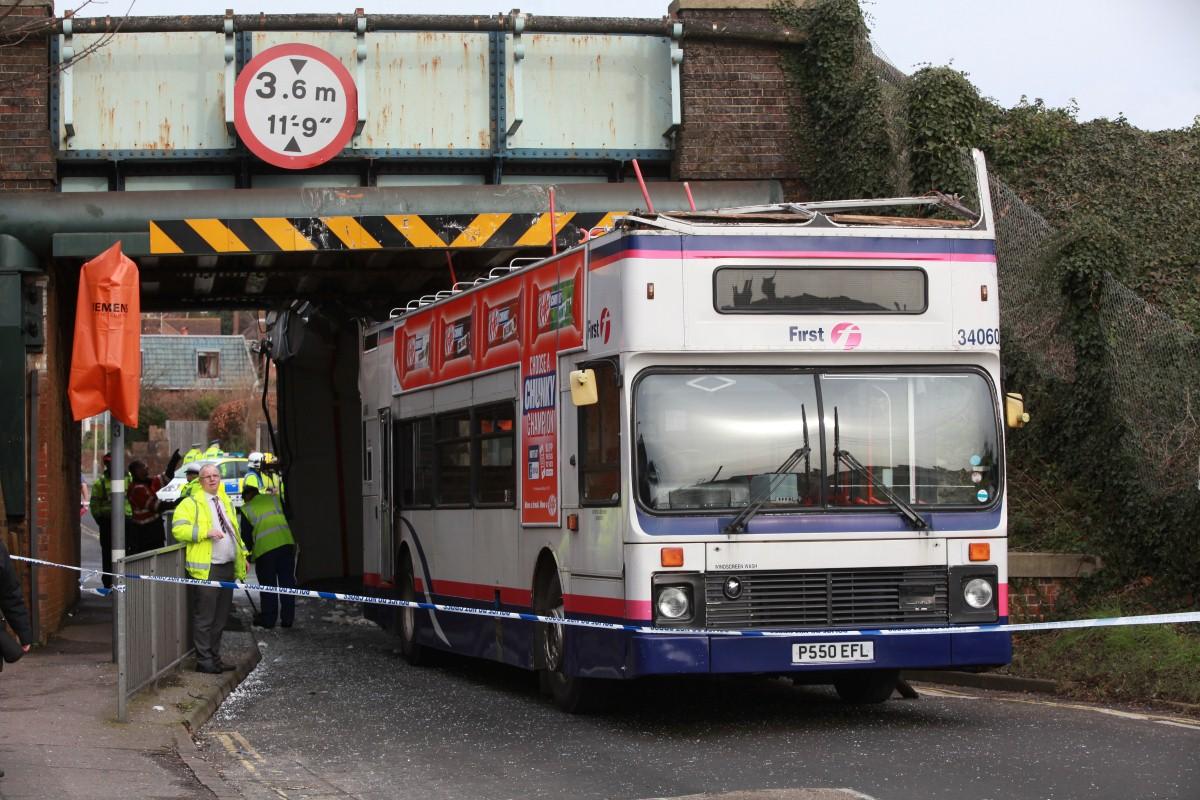 The Year in Pictures - 2013 - A bus had its roof torn off after hitting the railway bridge at Portchester Railway Station.