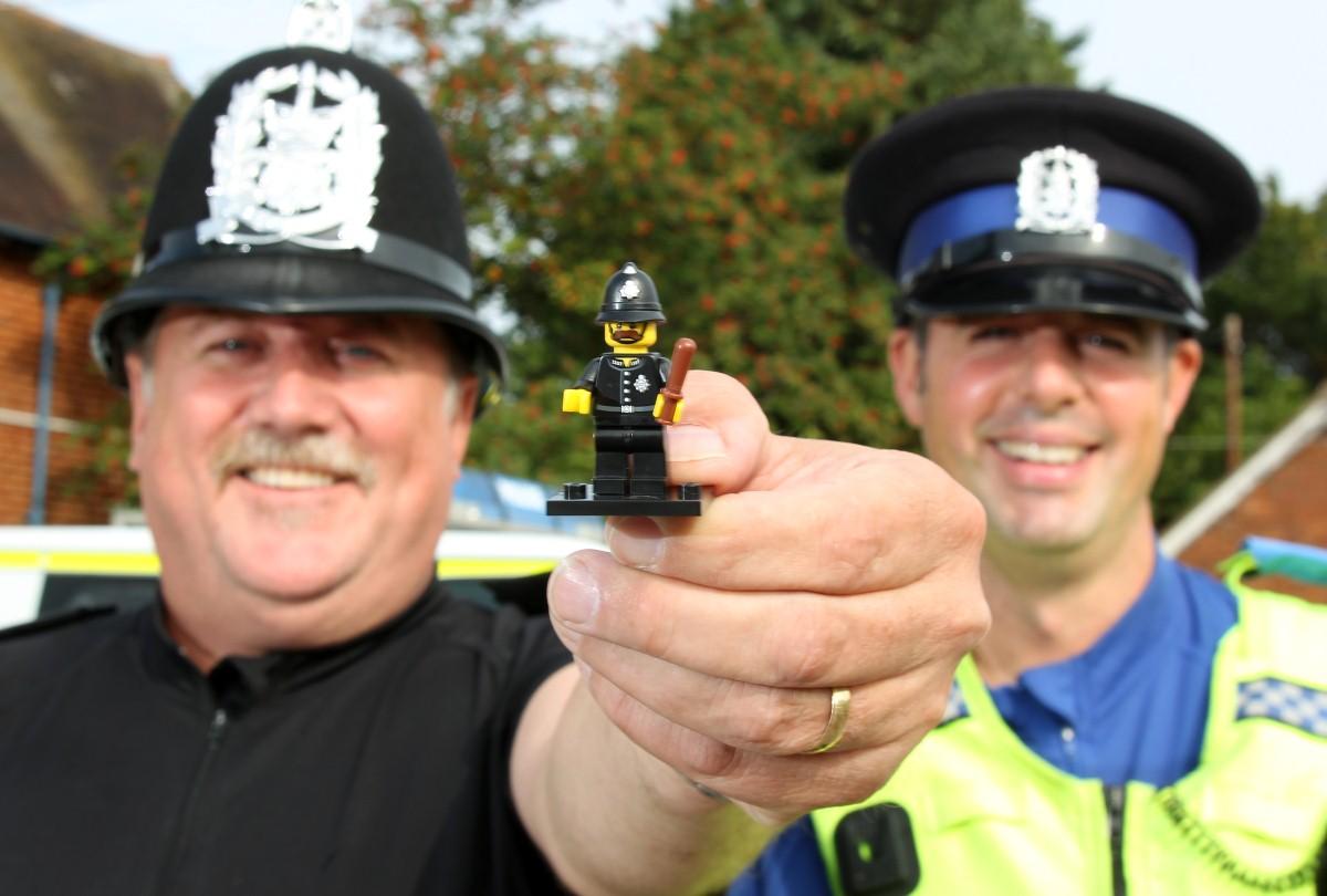 The Year in Pictures - 2013 - PC Rob Thomas has the same collar number as the new LEGO minifigure of a policeman. Rob is pictured here with PCSO Ian Nicholson who found the figure. September 27, 2013.