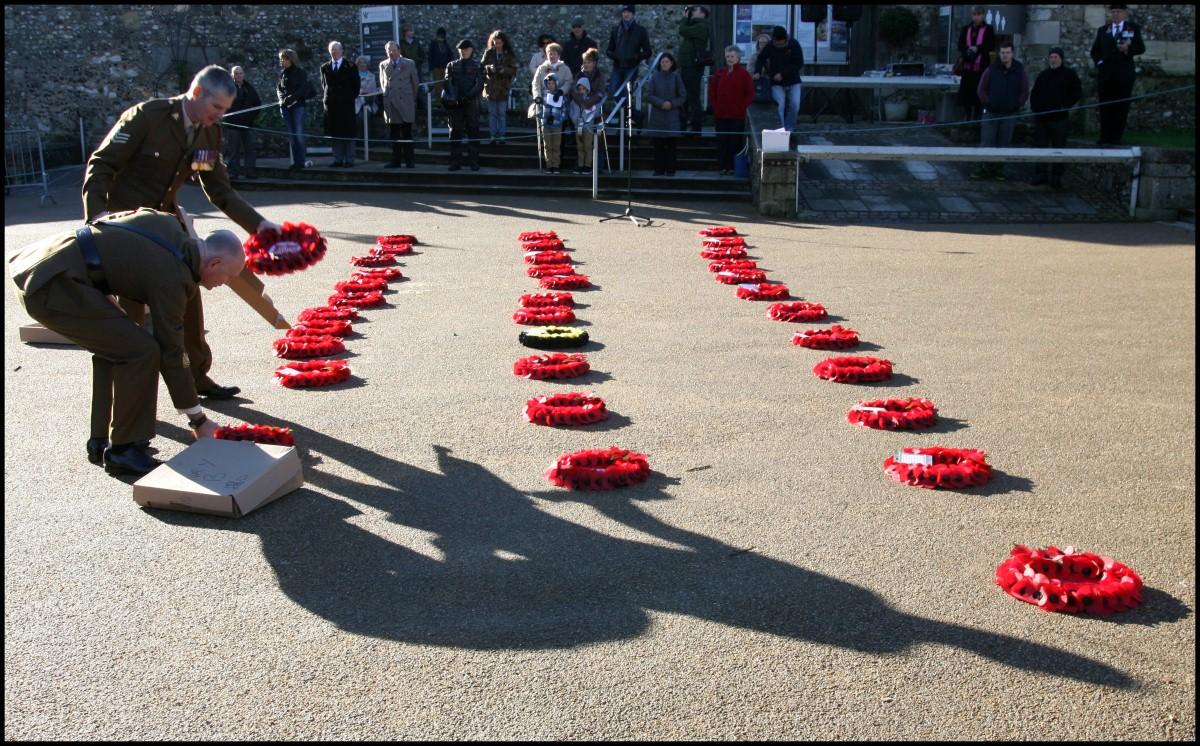 The Year in Pictures - 2013 - Soldiers lay wreaths in the correct positions before the remembrance service at Winchester Cathedral. November 10, 2013.