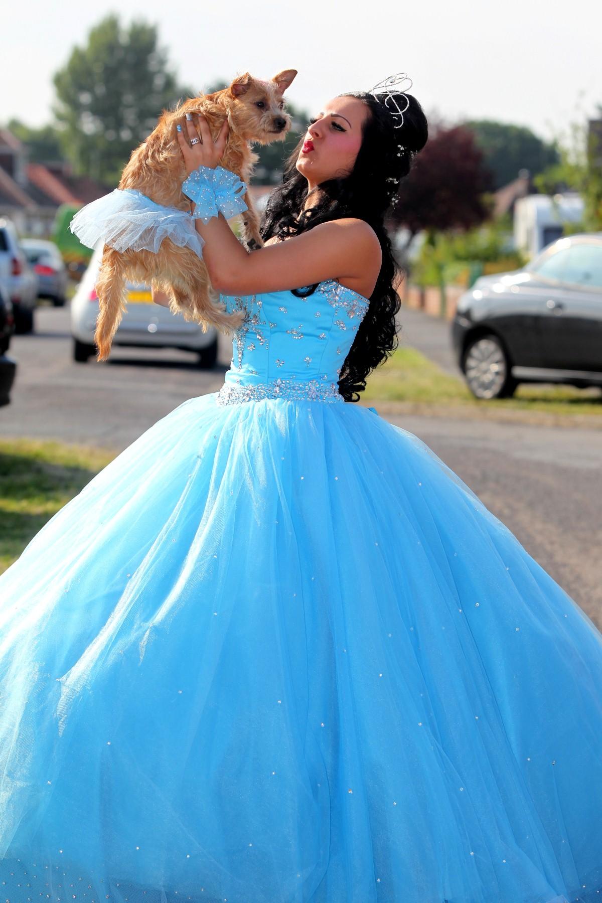 The Year in Pictures - 2013 - Molly Cooper-Lawson with her dog Dolly before she set off for her prom. July 5, 2013.