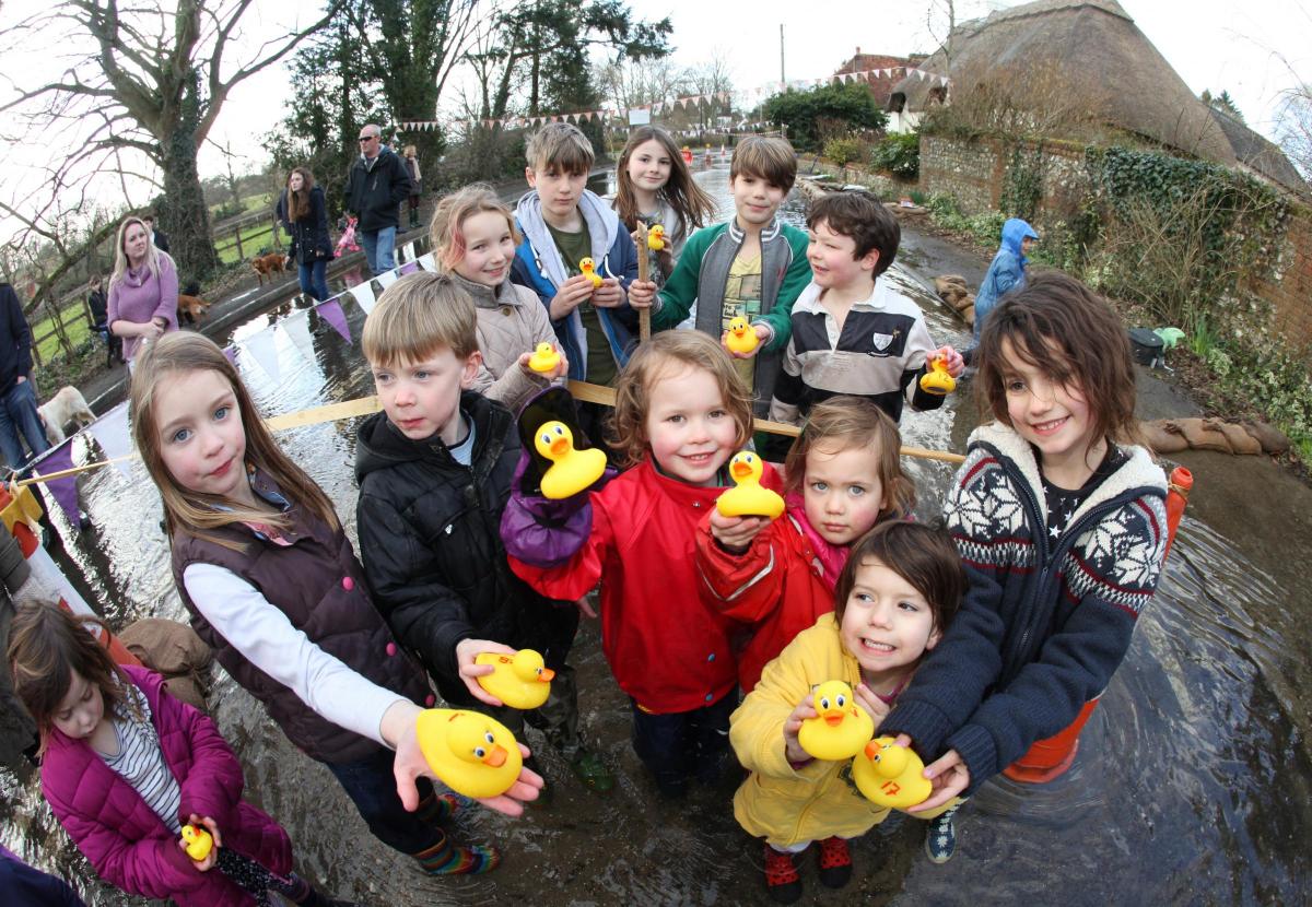 Duck race in Bramdean on the floodwater of the A272.