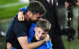 Saints manager Russell Martin celebrates with his son at full-time