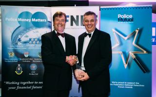 DI Martin Chudley (right) receiving the award