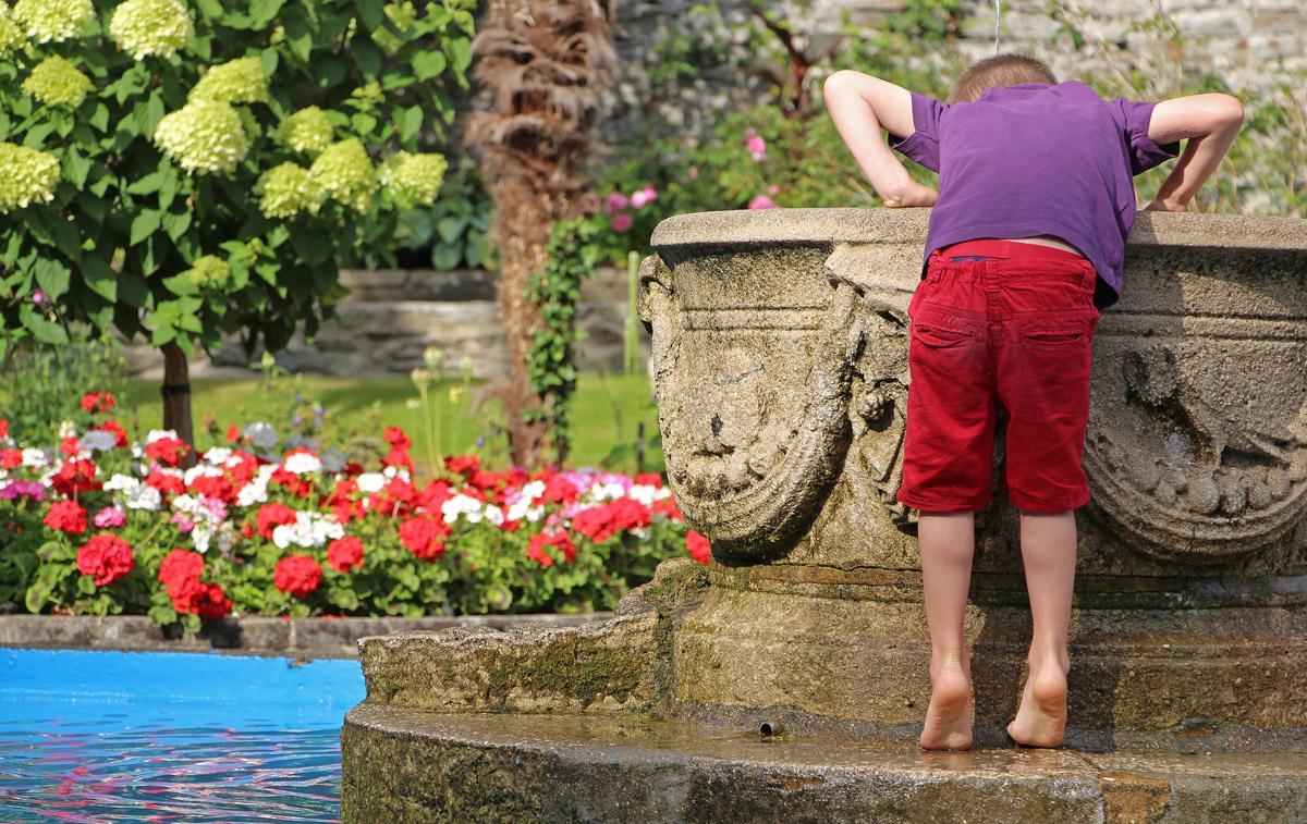 Carl Maskelyne - Son Joseph fishing for pennies in the wishing well at Portmerion in North Wales