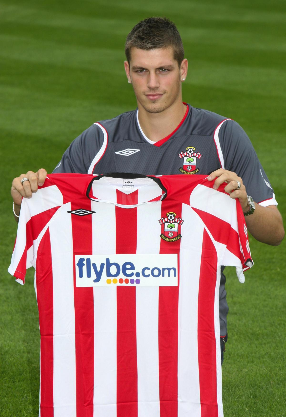 Morgan Schneiderlin poses with his new shirt after signing for Saints in June 2008.
