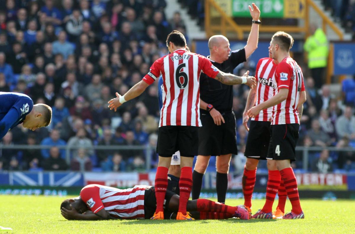Saints players remonstrate with referee Lee Mason