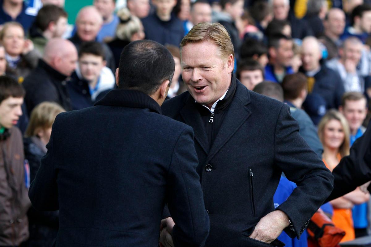 Koeman shakes hands with Everton manager Roberto Martinez