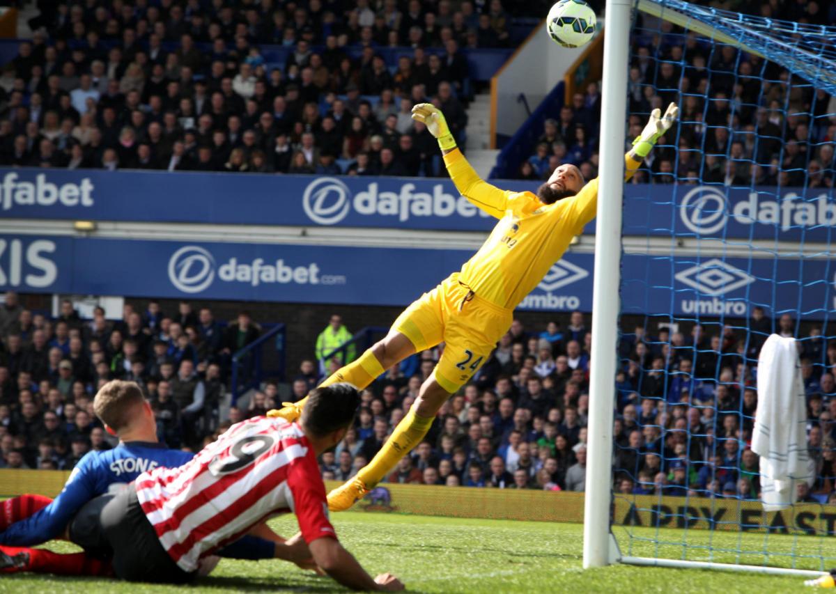 ..but is denied by a stunning save by Everton 'keeper Tim Howard.