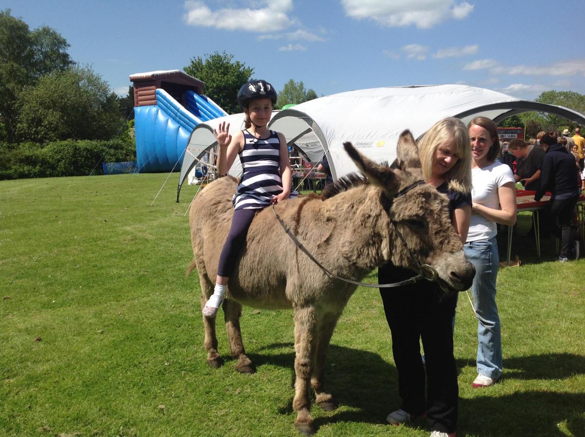 Lily Palmer, 7, of Millbrook, enjoying a donkey ride