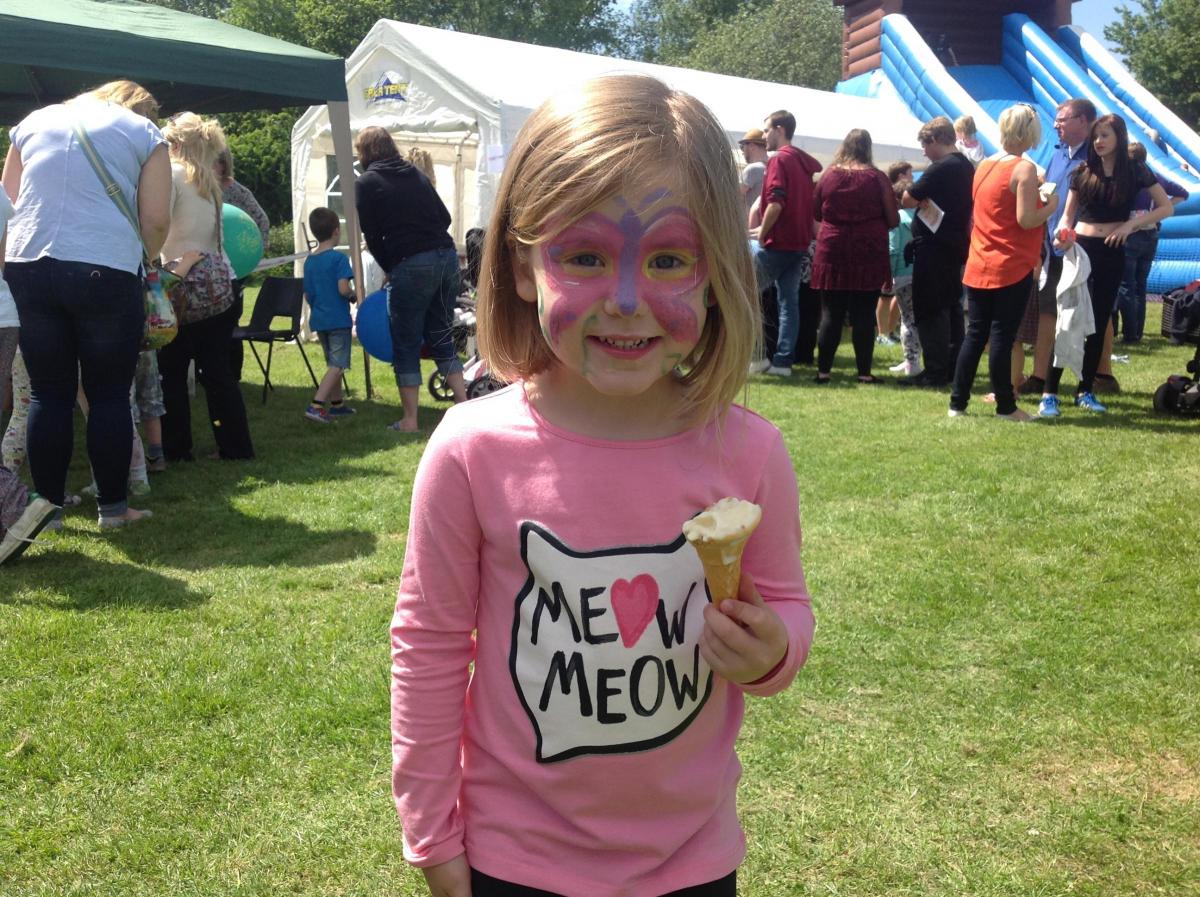 Tia Houghton, 4, of Rownhams enjoying an ice cream with a butterfly face paint.