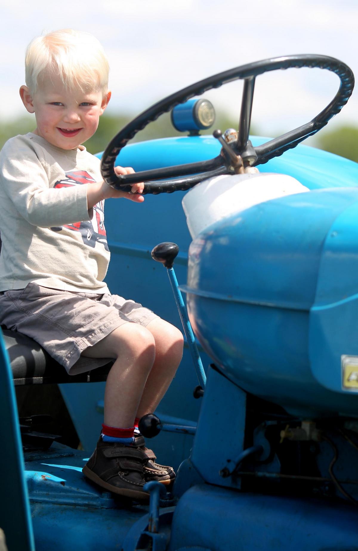 West Dean Fete - Daniel Meehan, three, aboard a tractor