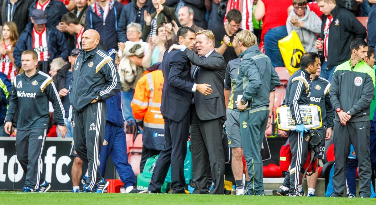 Koeman consoles Sunderland manager Gus Poyet after his team hammer the Black Cats 8-0 at St Mary's, in October.