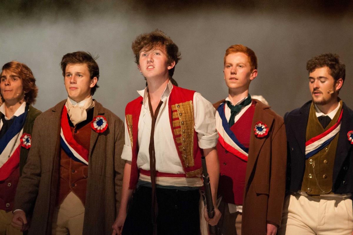 Enjolras (Cameron Taylor) rallies the troops