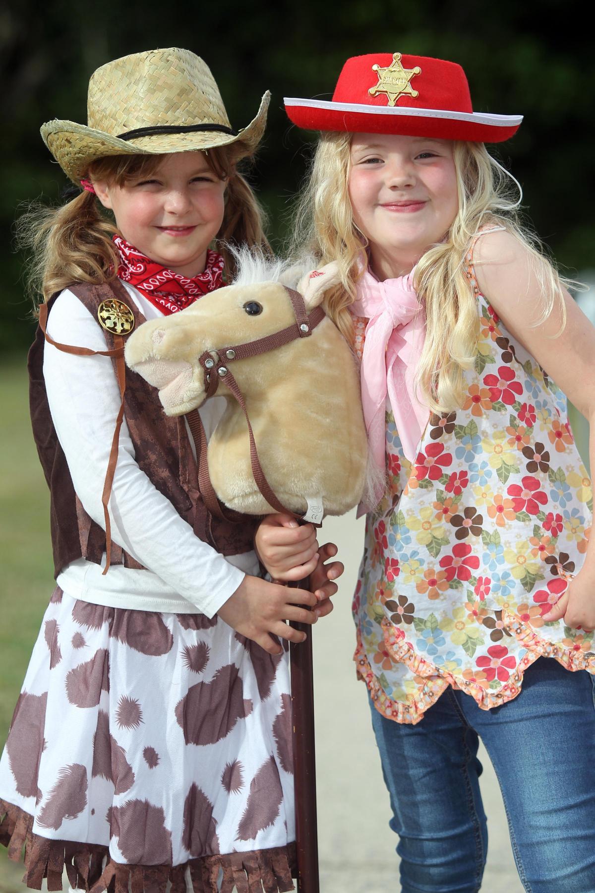 Bryony Hodgkinson, 8, and Lola Clancy, 6, (R). Sway Carnival 2015, Jubilee Field, Sway. Photograph: Chris Moorhouse. Friday 10th July 2015 (31714872)
