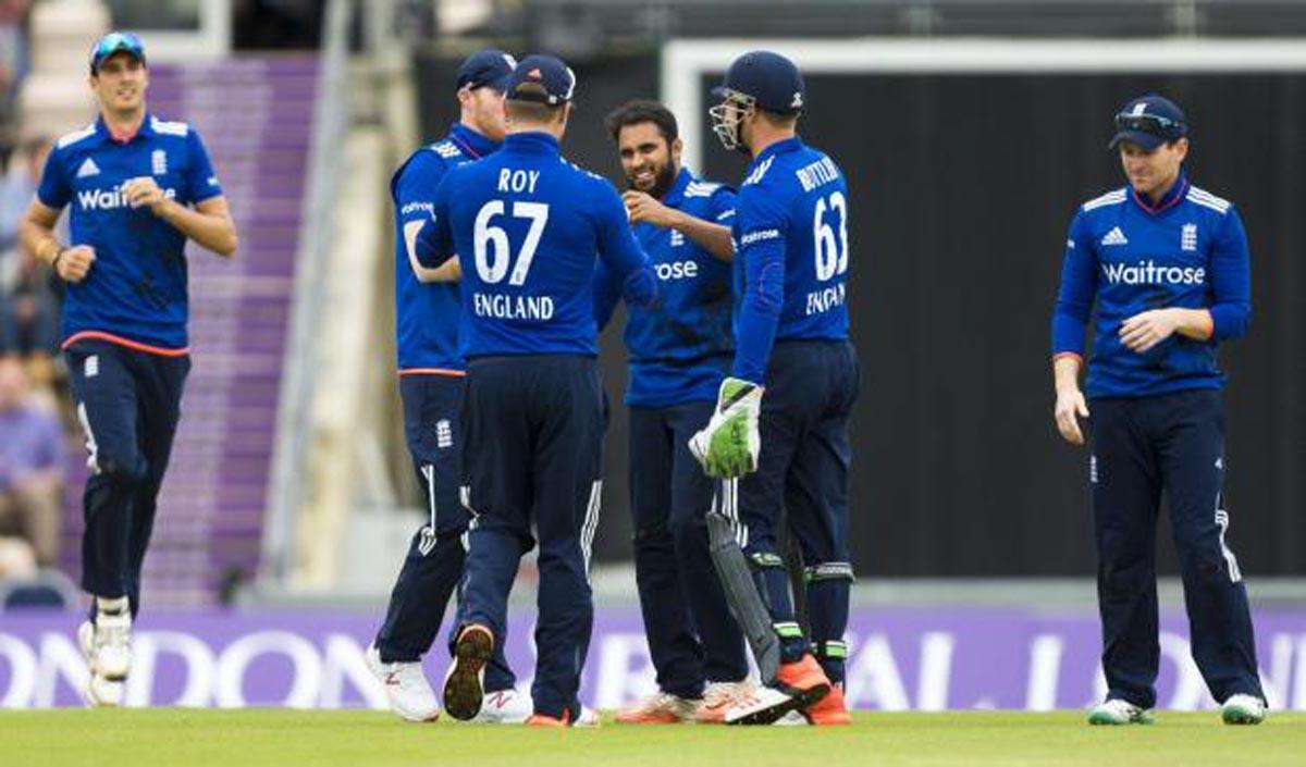Rashid his congratulated by his England teammates after the wicket of Burns
