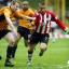 POWER SHOW: Kevin Phillips beats Jody Craddock to lash in his second goal. Echo picture by Paul Collins 