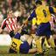 CAUGHT IN THE MIDDLE: Paul Telfer (number 33, centre) finds himself grounded as Brentford players scrap for every ball, while Matt Oakley is quickly on hand to clear the danger for Saints. Daily Echo picture by Paul Collins
