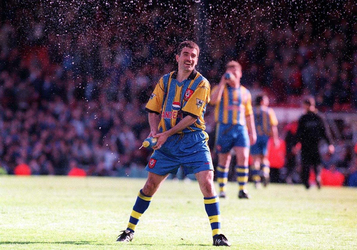 Celebrating Premier League survival at the end of the 1995-96 season