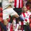 HEADS: Saints defender Wayne Thomas rises for a challenge.
