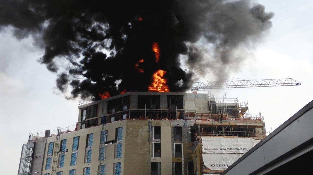 There were dramatic scenes as a fire broke out on the roof of Mayflower Halls in 2014 as it was being built. No-one was injured. Picture: James Rostance