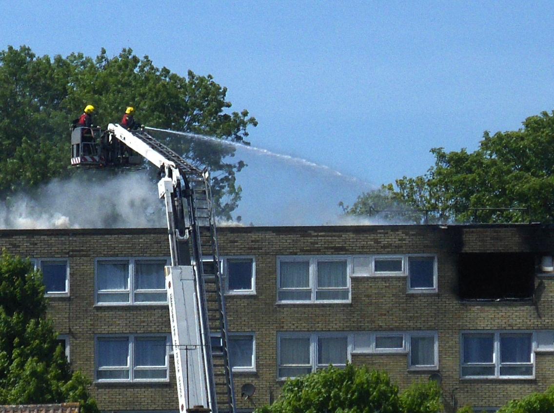 Fire crews dealing with a flat fire in 2010