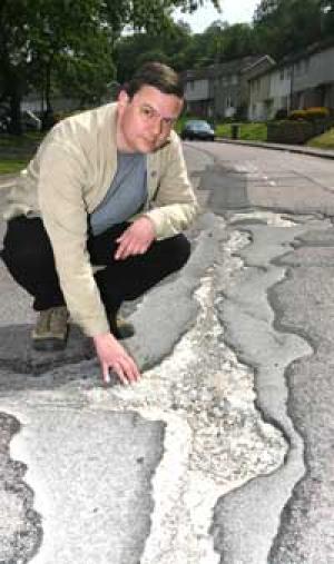 12m RUT: Cyclist Matt Probert in Cheriton Avenue, Harefield.