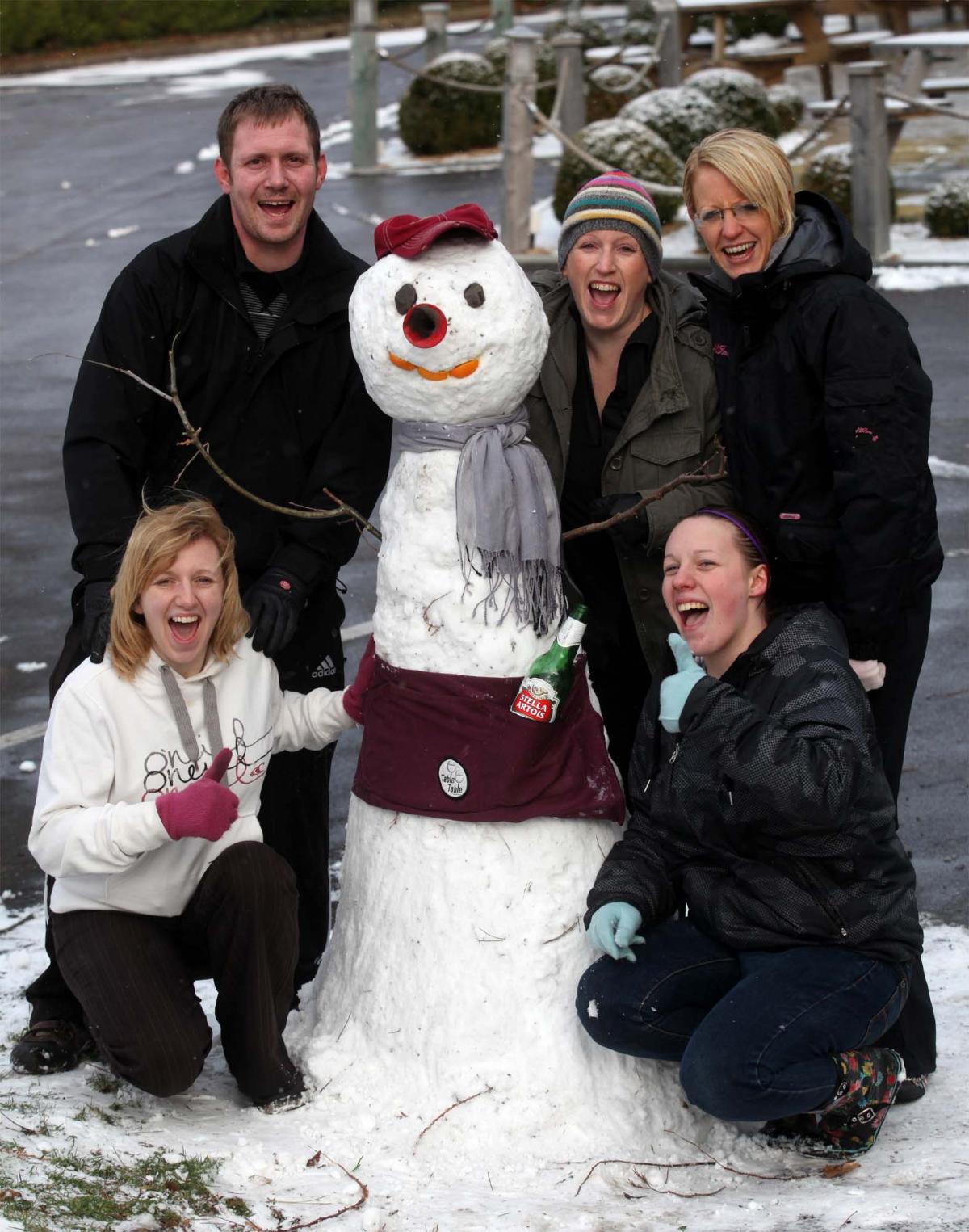 Staff at The Heath pub in Dibden Purlieu make a snowman