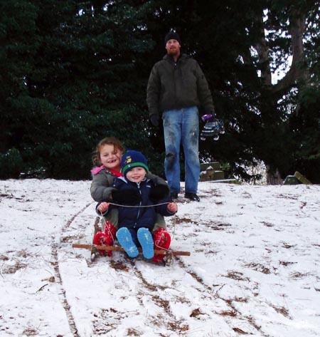 Snow covers Hampshire - Cousins Jack and Amber Williams sledging in Netley