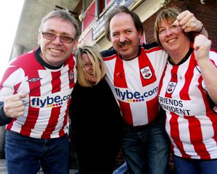 COME ON YOU SAINTS: Fans Graham New, Anna Coward, Wayne New and Madeline New back the Saints outside The Royal Oak pub in Houndwell Place, Southampton