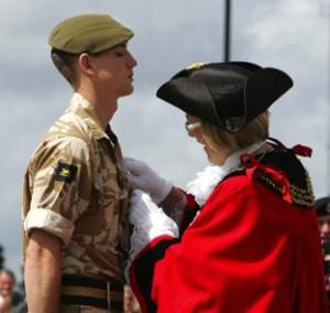 DECORATED:  Pte Callum Daly receives his medal from Mayor Liz Mizon. Echo picture by Paul Collins. Order nos: 8885560