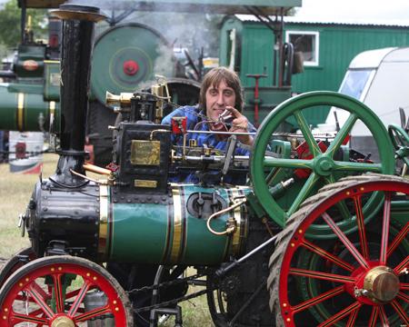 Dave Price of Fisher’s Pond feeds Titan his Barrell Traction Engine some oil to make her spick and span for the show. 
