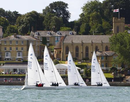 The Etchell fleet heads past Holy                       Trinity church as they leave the start.