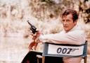 FILE - British actor Roger Moore, playing the title role of secret service agent 007, James Bond, is shown on location in England in 1972. Moore, played Bond in seven films, more than any other actor.  Roger Moore's family said Tuesday May 23, 2017 th