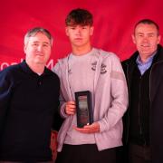 Tyler Dibling with the under 18-21s award.