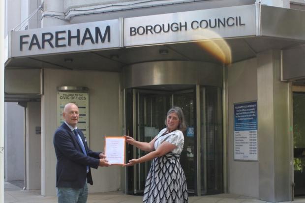 Zoe Aspinall from the Green Party and Tony Goodridge from Save Our Strategic Gaps posting the petitions.